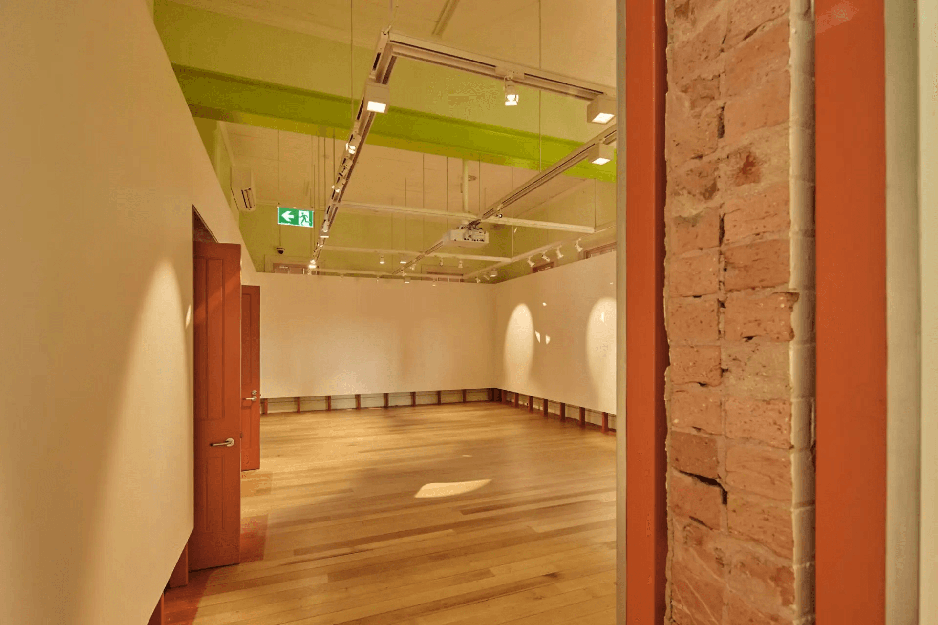 Old room converted into exhibition space with modern lighting